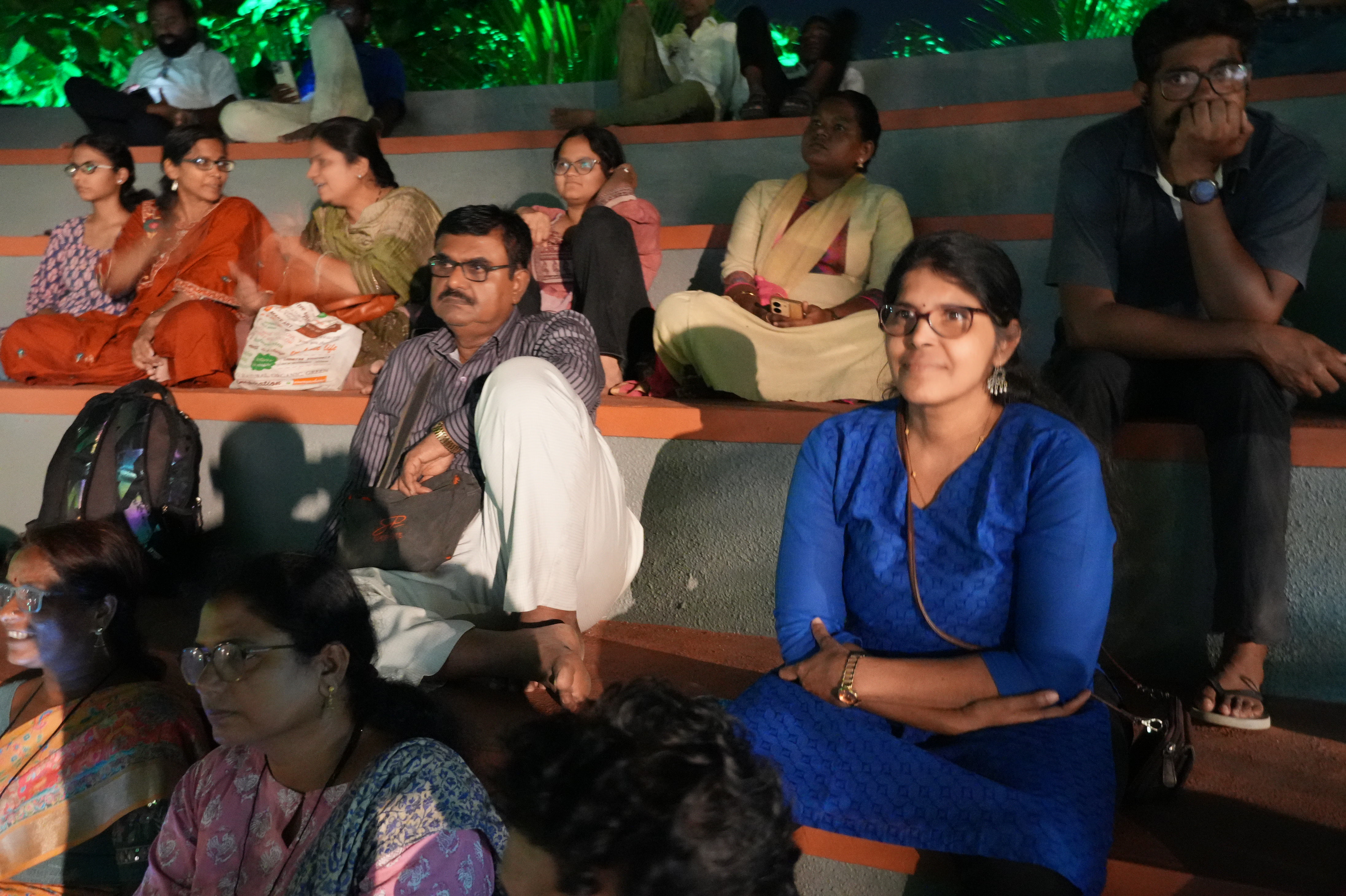 Evening audience seated during cultural performance